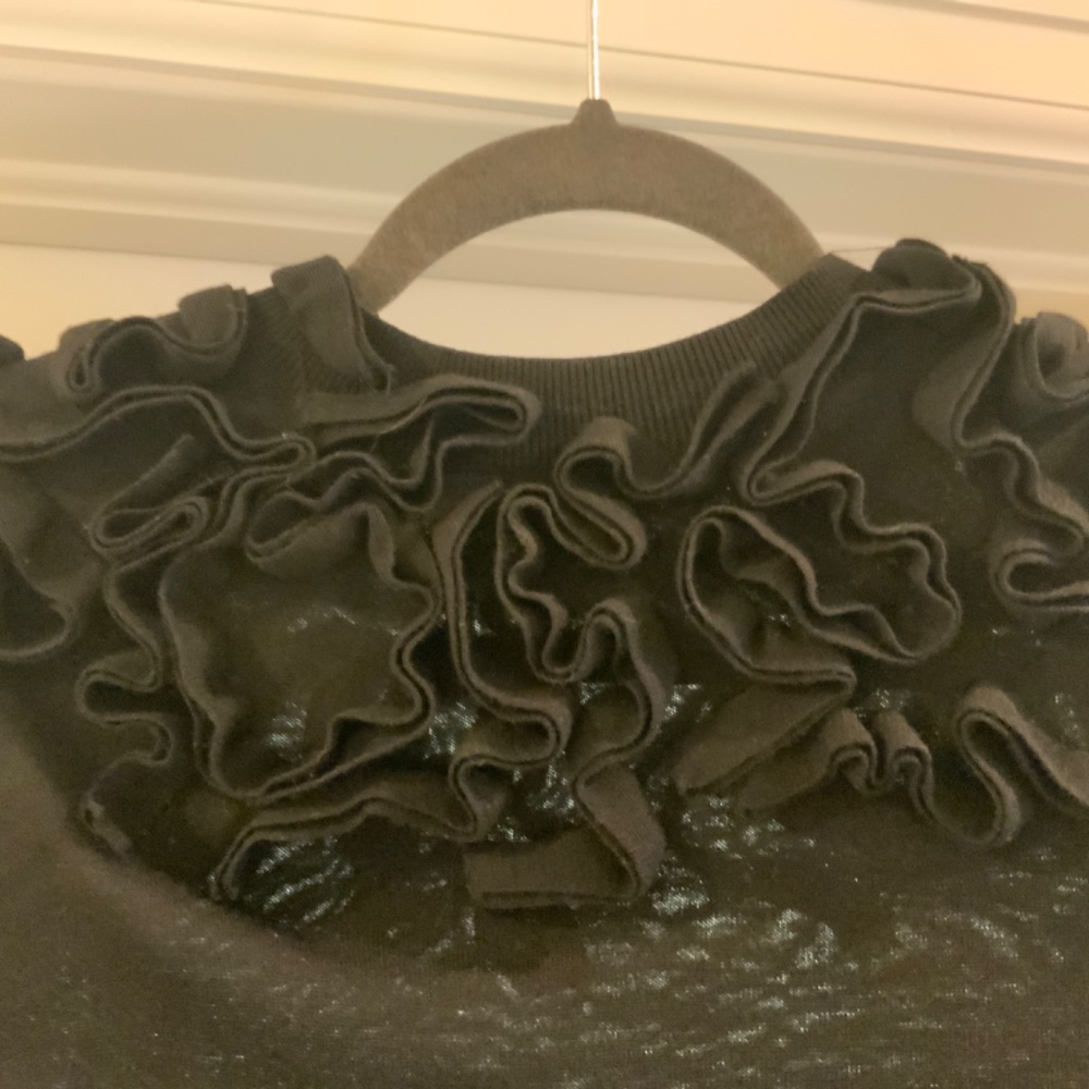 COS Black women’s sweater with Rosette detailing around the bodice.